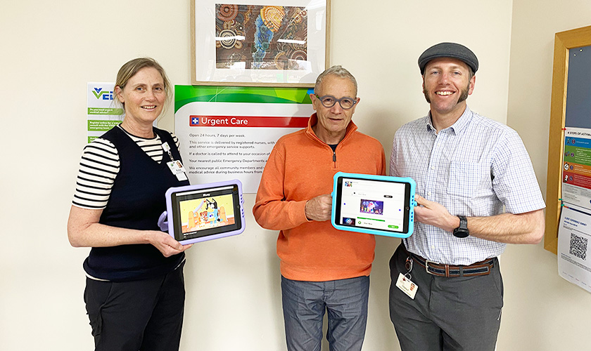  Local GP Mark Zagorski with Kate Welleman and Daniel Van Der Ploeg with two ipads set up for children to use when attending urgent care